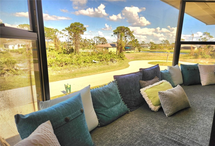 view of lake from bay window.  All new cushions and pillows