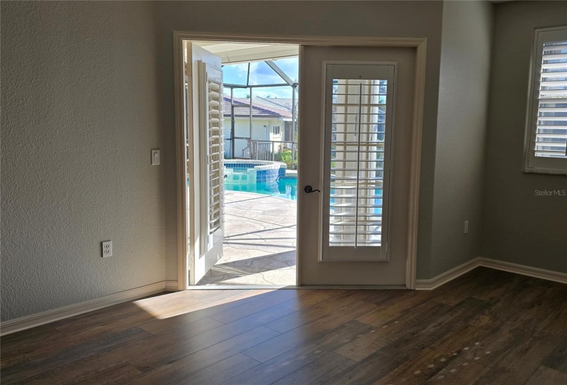 Primary Bedroom French Doors out to Pool