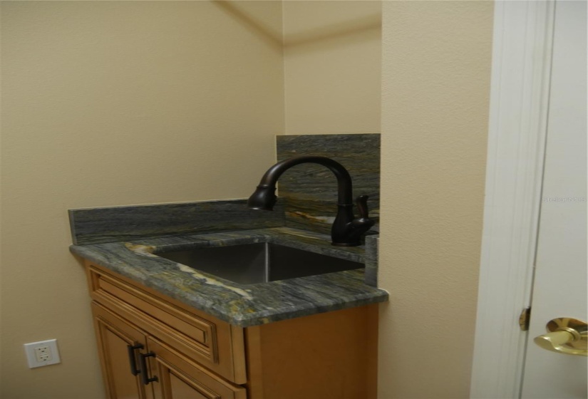 The right side offers a closet and a brand new custom cabinet, sink and faucet with a granite slab surround!