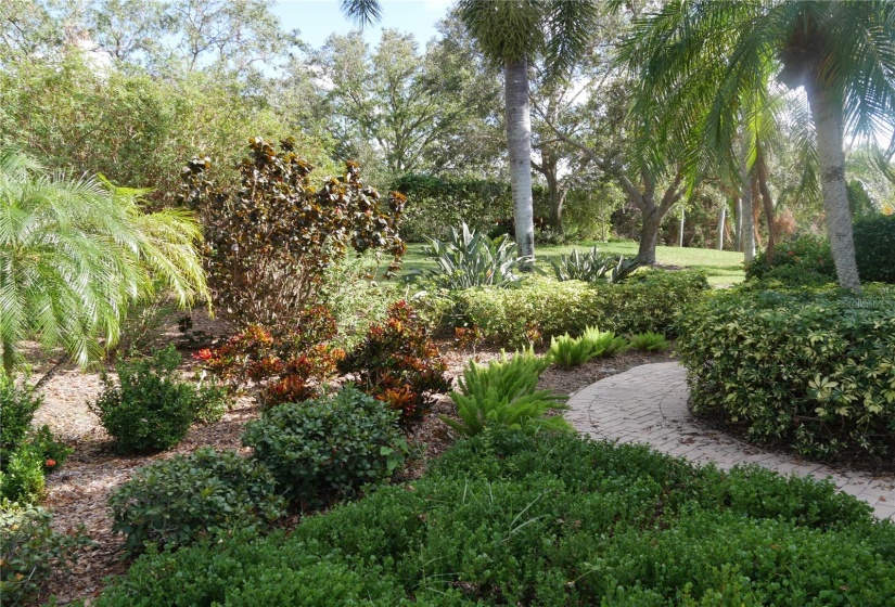 This walkway brings your guests past all of this foliage (maintenance-free), to your side-entry front  door!