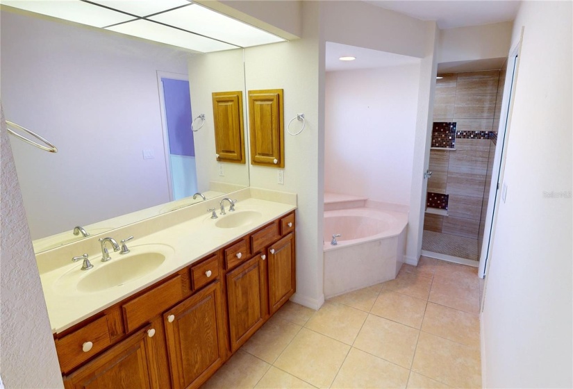 Dual sinks separate tub and walk in shower