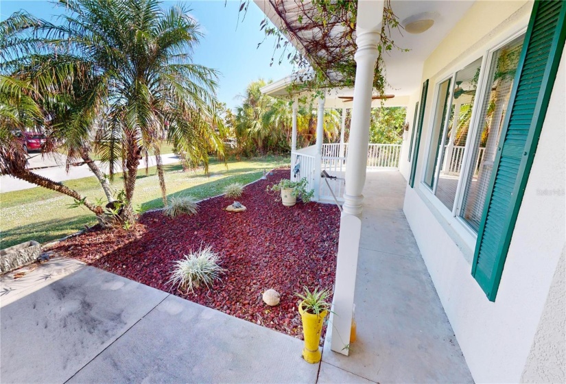 Covered front porch with sitting area.