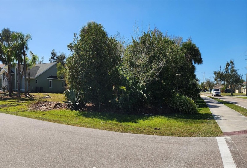 side view from the corner of Deep Creek Blvd and Santarem, there are painted lines in the street indicating the property line for you to see.