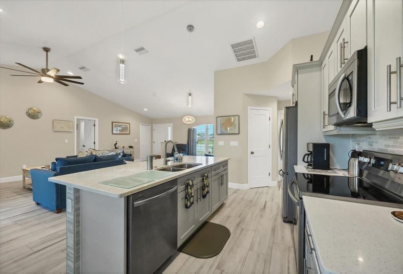 The kitchen offers an open, spacious layout with a deep sink.