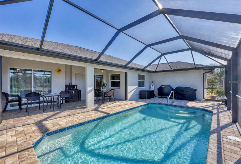 Heated pool with a spacious paver deck