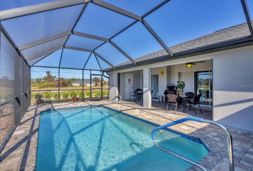 Large paver deck with a covered lanai