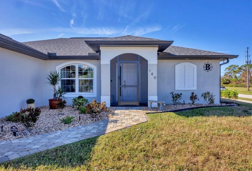 Welcome home to landscaped grounds and a paver walkway