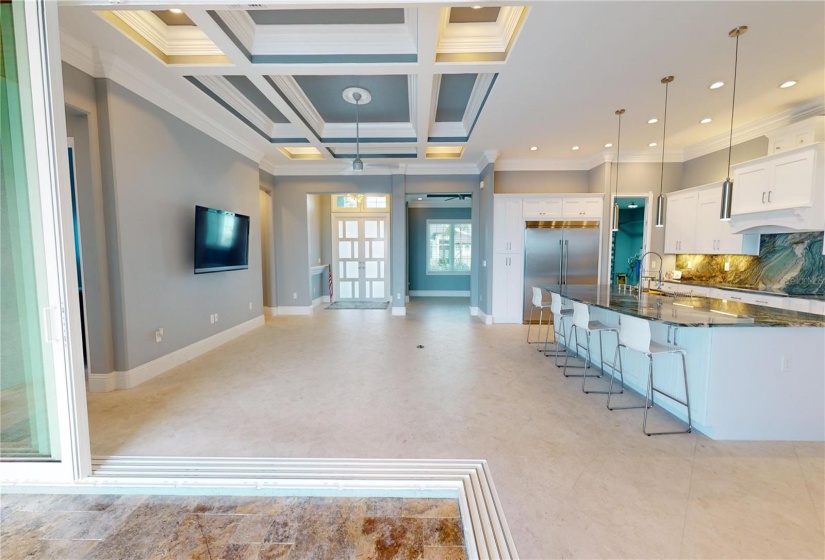 Great room and kitchen view from screened pool enclosure