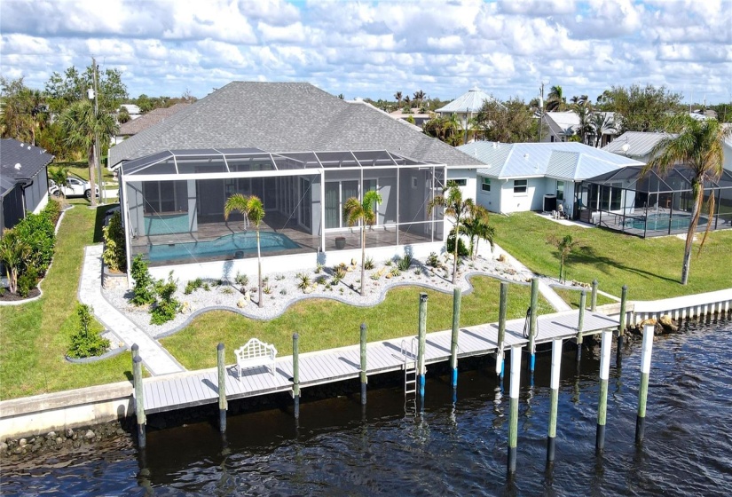 Rear aerial view of home and waterfront