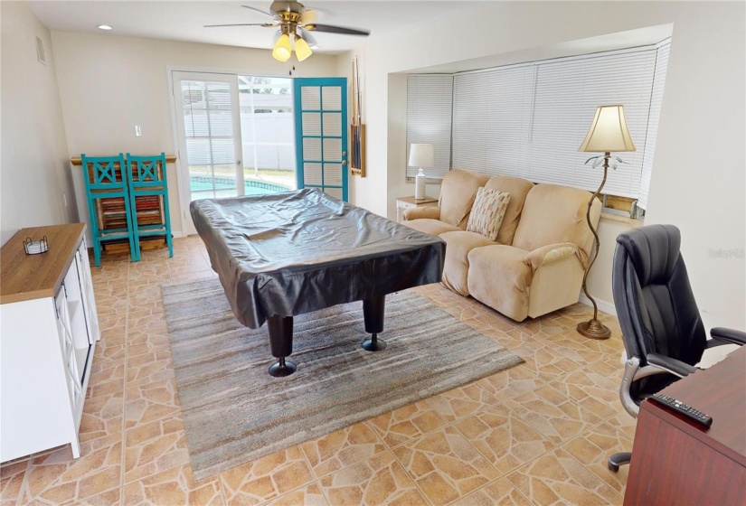 Family room with pool table and pool access door