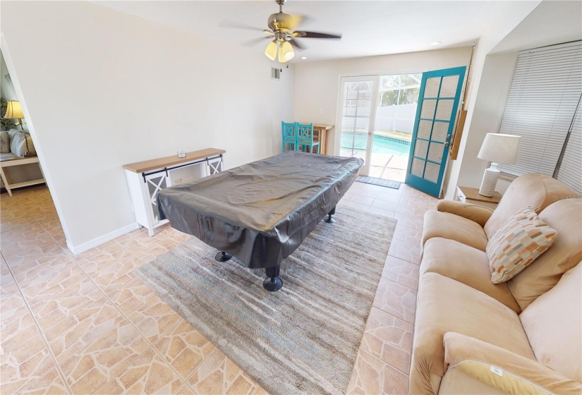 Family room with pool table and pool access door