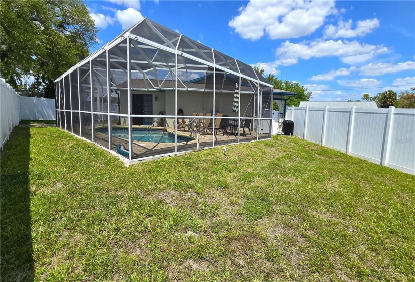 Fenced backyard and screened pool enclosure