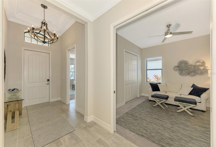 Entry with beautiful tile flooring, front bedroom, Jack and Jill bath, 2nd bedroom used as an office with a sleeper sofa.