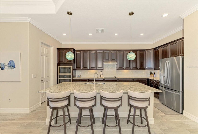 Fabulous gourmet kitchen, large walk in pantry, counter to make quick dining easy.