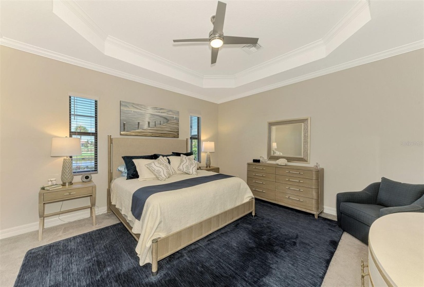 The master bedroom is large, with plenty of space for a full suite of furniture.