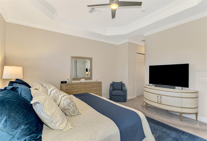 The master bedroom is large, with plenty of space for a full suite of furniture.