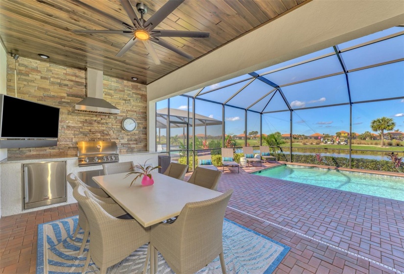 The lanai is stunning, outdoor kitchen, pool, spa, overlooking water and golf.