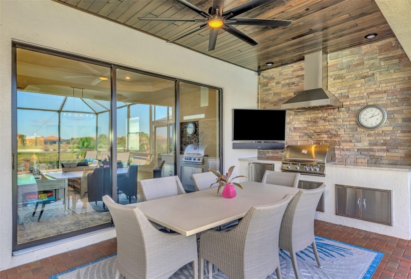 The lanai is stunning, outdoor kitchen, pool, spa, overlooking water and golf.