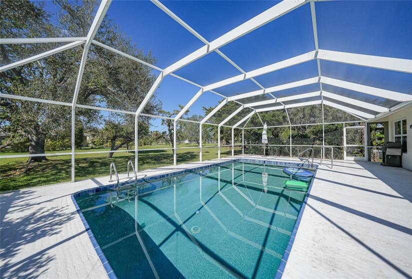 Pool overlooking park like greenbelt