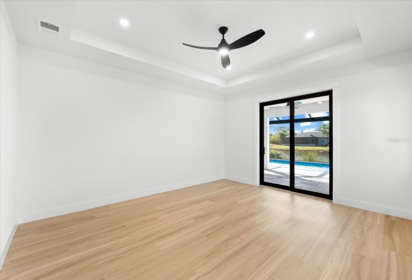 Primary Bedroom Featuring Tray Ceilings