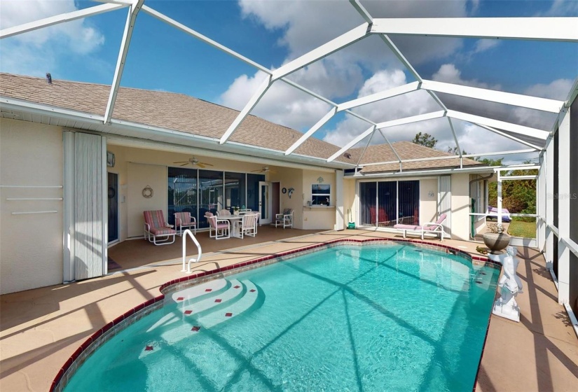 Plenty of pool deck for sunning, and don miss the accordion shutters.