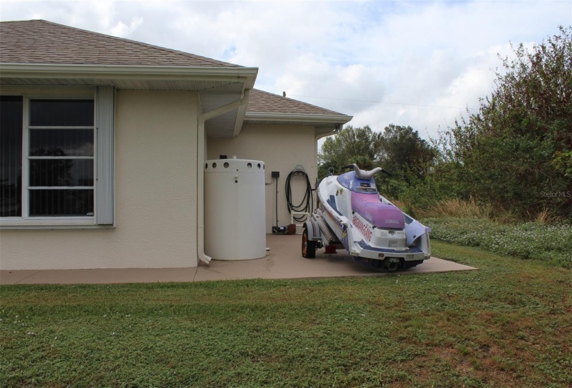 Extra concrete storage area and walks around the house.