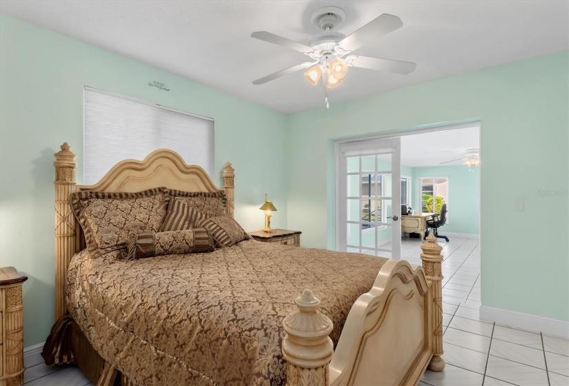 View from guest suite towards Florida Room, accessible through glass-paned French doors.