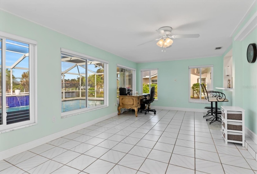 Enjoy overlooking your beautiful pool area from the roomy Florida Room. Over 250 sq ft of air-conditioned comfort surrounded by impact windows.