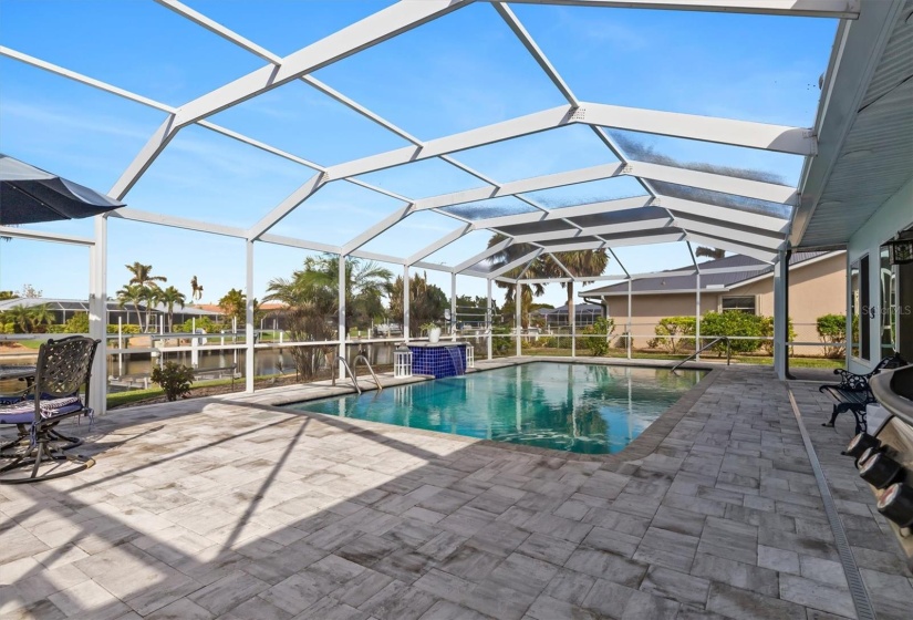 Newly screened pool cage and plenty of room for outdoor enjoyment and entertaining.