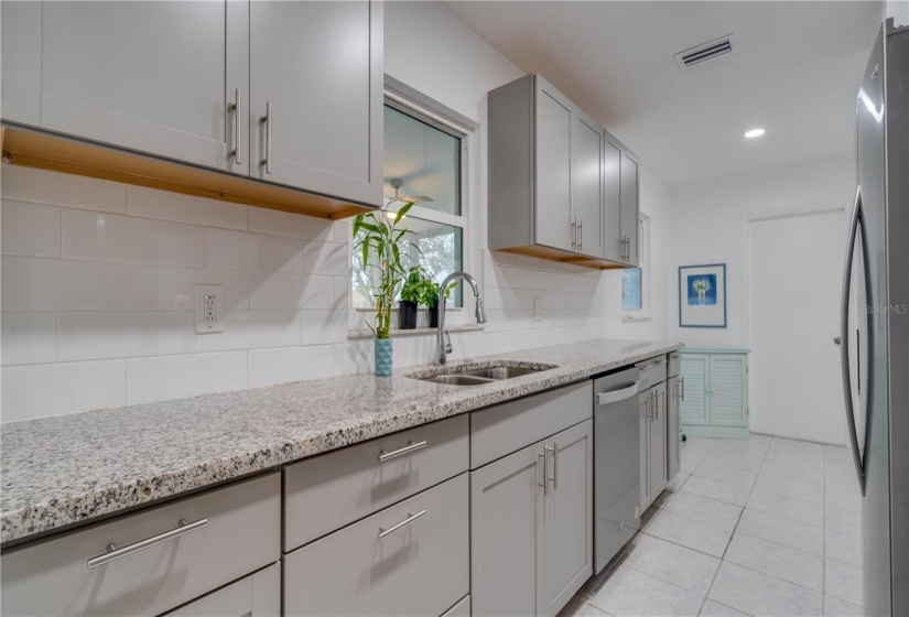 Kitchen with light gray cabinets