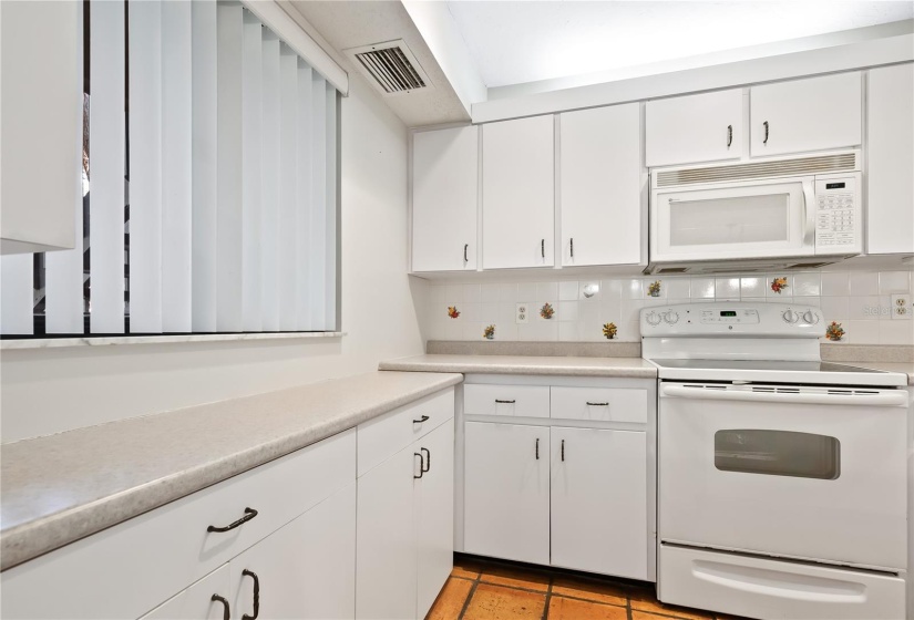 Kitchen has open counter to the dining room