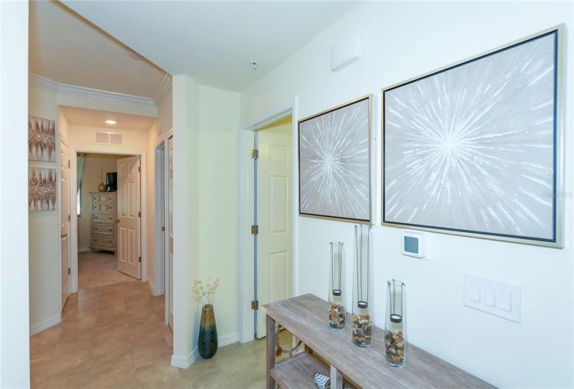 Hallway to guest beds and bath near front of condo