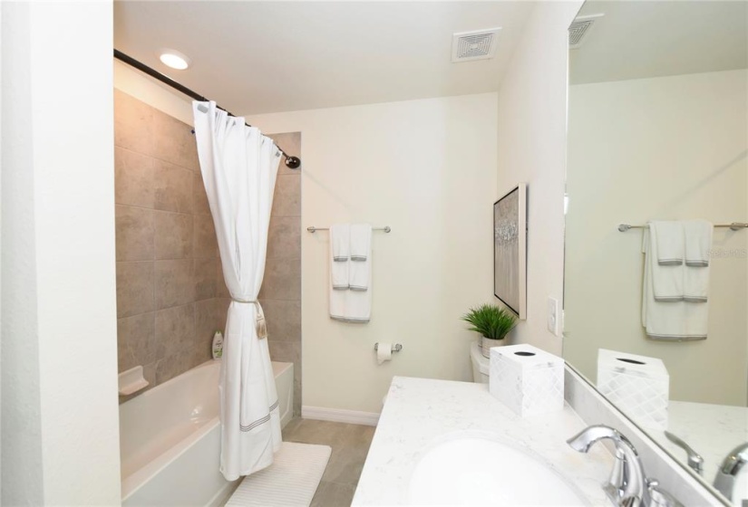 Guest bath with shower/tub combo and double sink