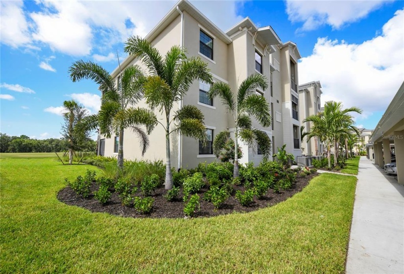 Front/side view of building .Condo is the left corner unit