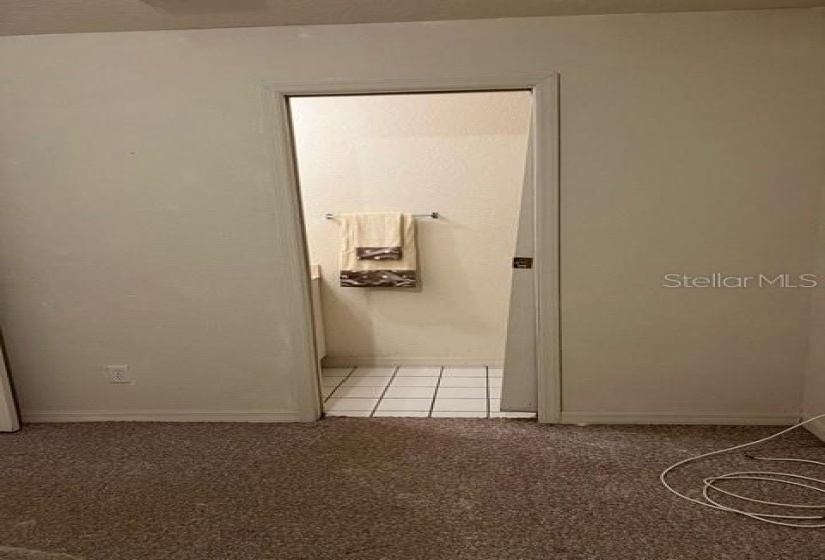 Entry to ensuite half-bath in the Master bedroom.