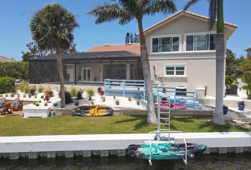 View of back from dock with kayak lift on seawall