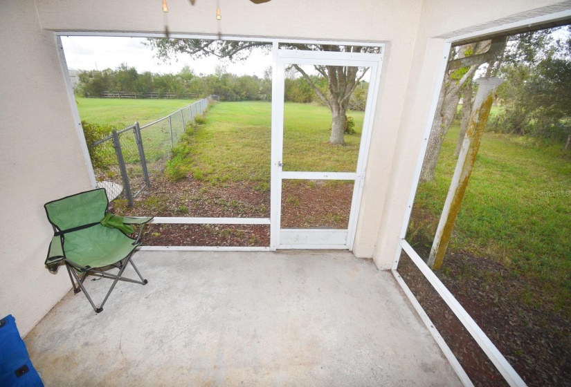 Screened 2nd patio for pets and leading to 1/4 acre fenced dog run.