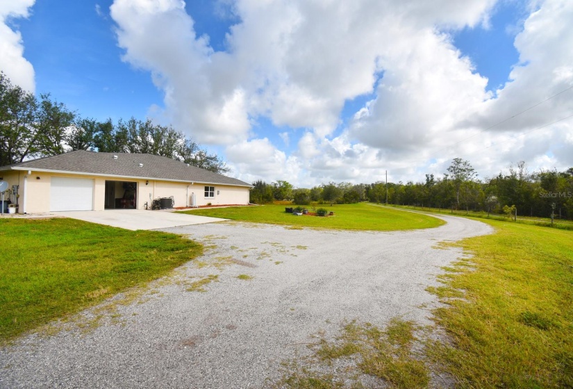 Driveway view to south side of house