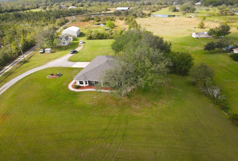 Aerial view of house and outbuildings