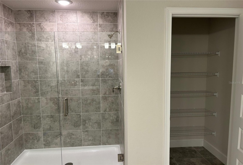 Master Bathroom shower and linen closet