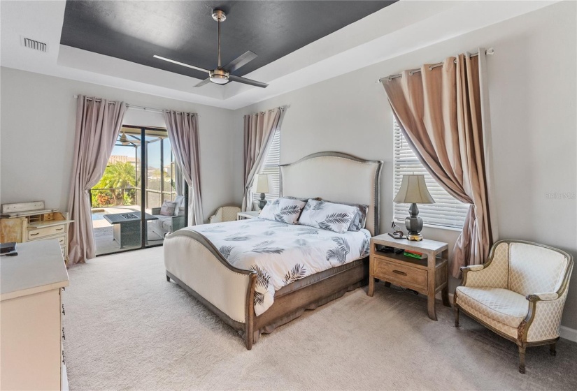 Primary Bedroom with Sliding Glass Door access to Spa and Pool