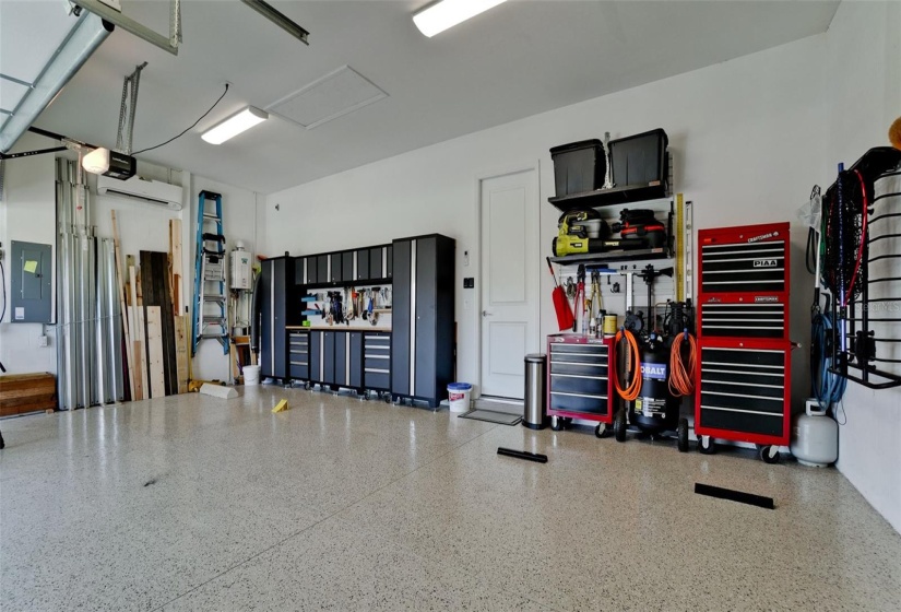 3-Car Garage with automatic/timed lighting, finished flooring; Garage Attic space has been fully insulated and a mini-split A/C added