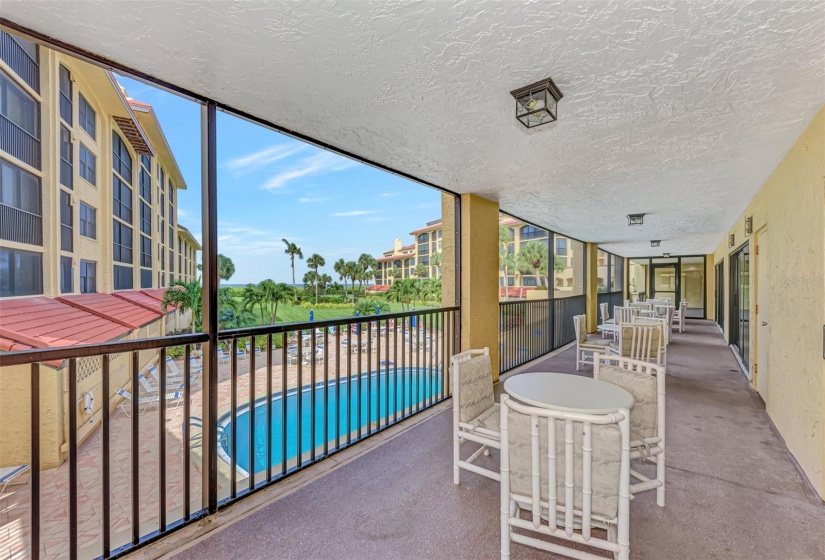 Community room overlooking the pool, landscaped yard and Gulf of Mexico