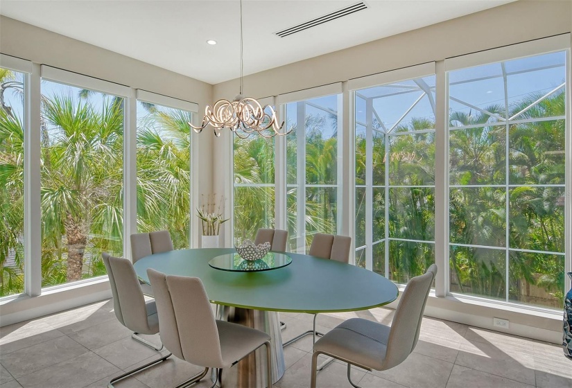 Dining Area with floor to ceiling windows which are electronically operated.