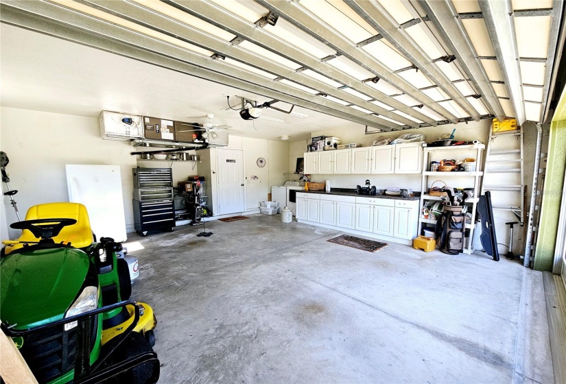 garage with built in storage cabinets-washer & dryer