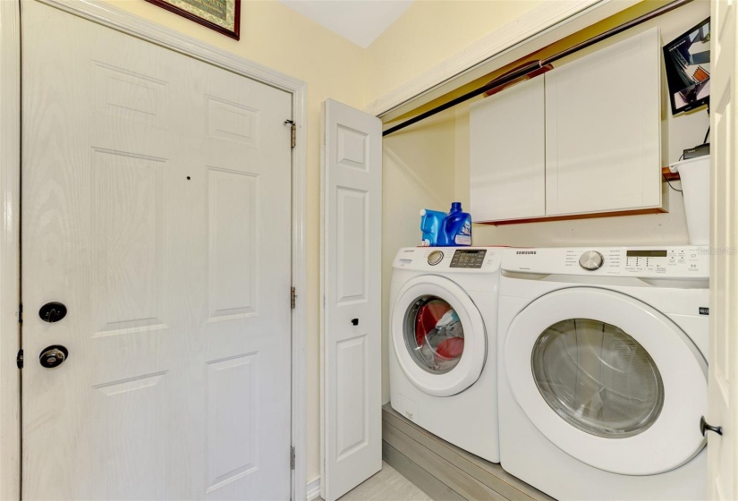 Laundry with storage cabinets