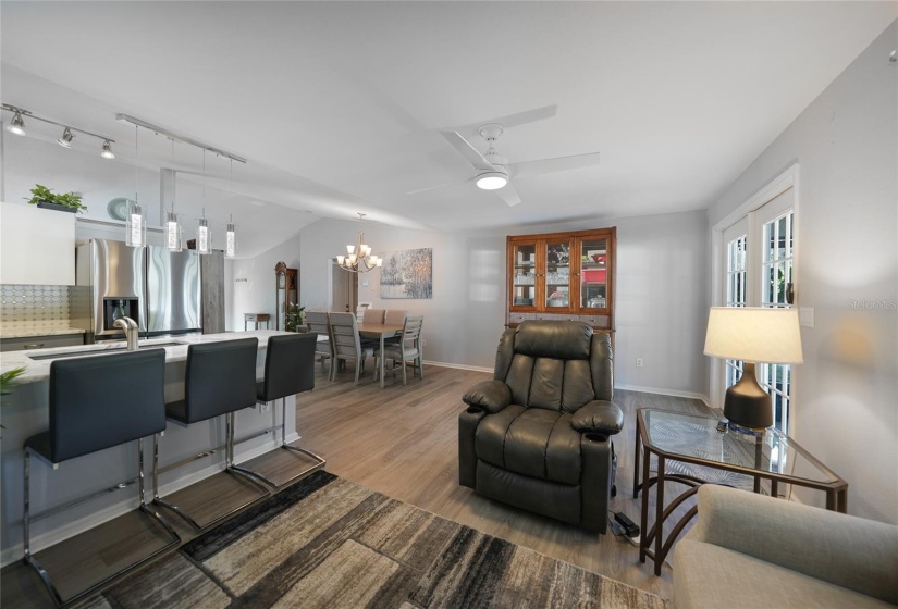 view from corner of living room looking back to breakfast bar and dining area