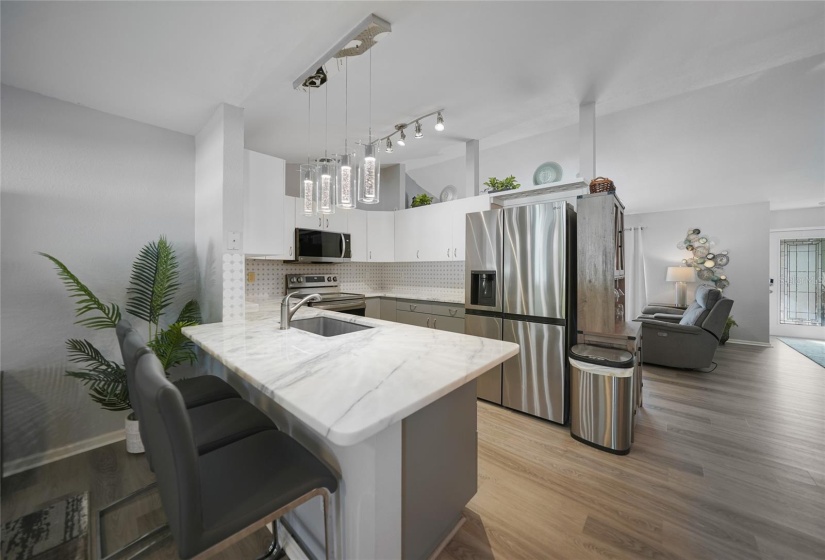 Kitchen with breakfast bar adding plenty of seating or enjoying watching the chef