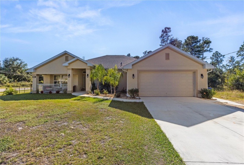 Mature landscaping wraps the home creating beautiful curb appeal.