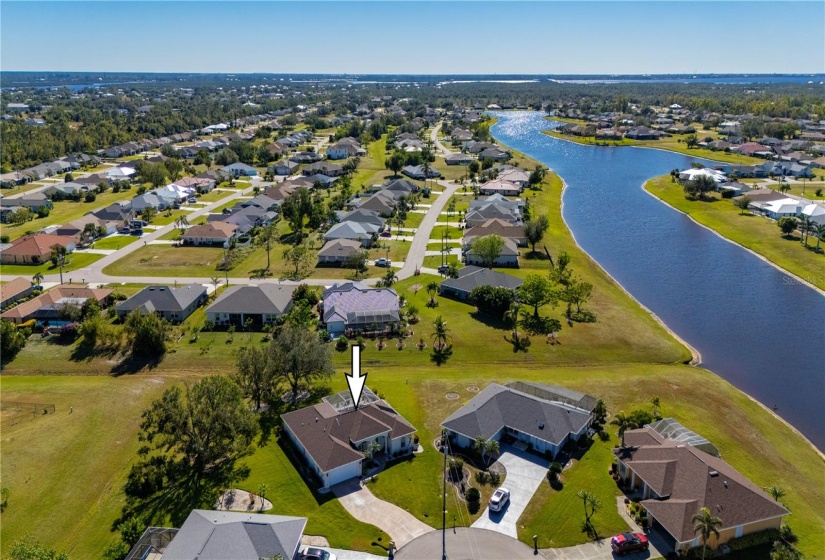 Aerial view shows engineered storm drainage and nearby lake